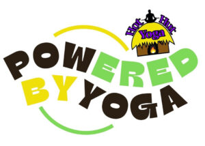 Silhouette of a person meditating in lotus pose against teal background.