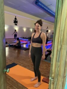Woman smiling in a yoga studio.
